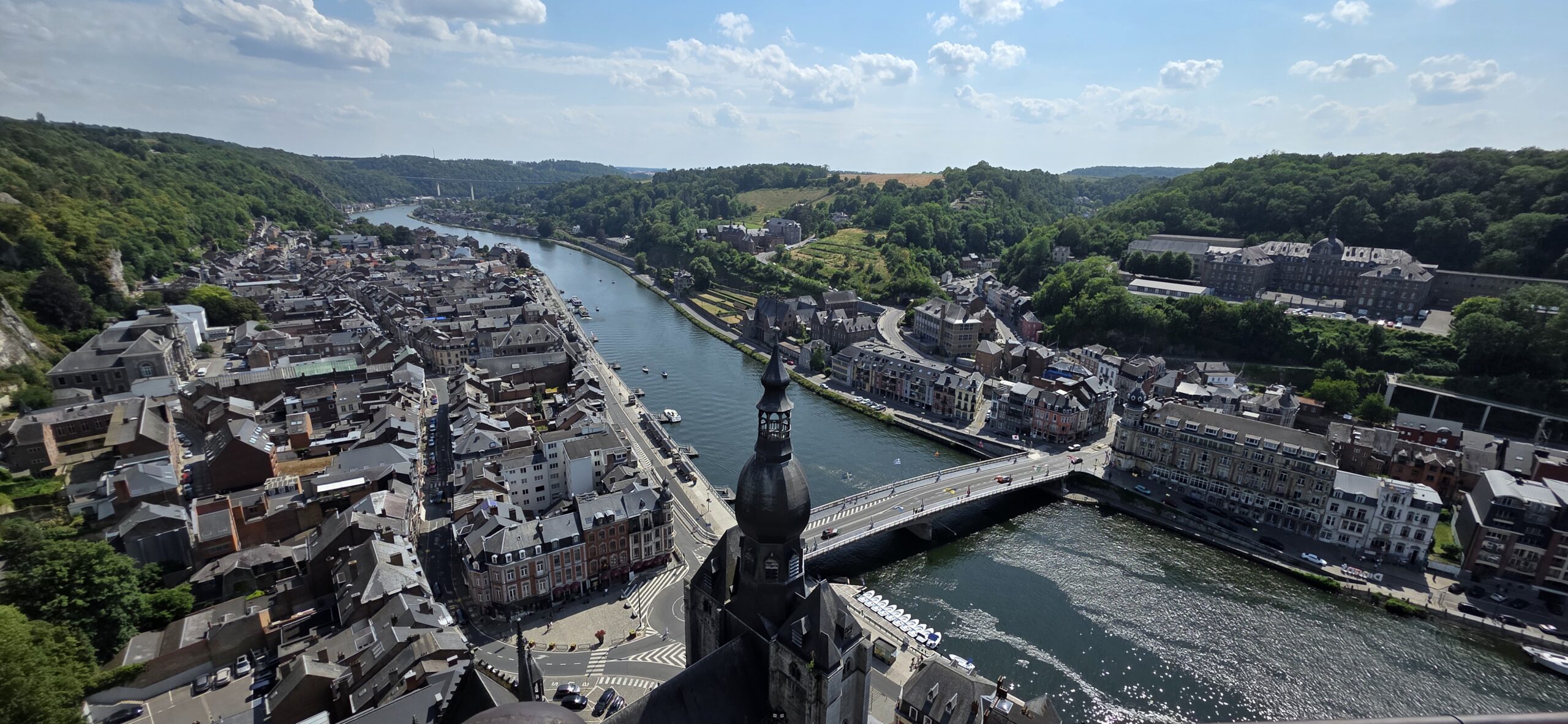 The Meuse river winding between limestone cliffs in the Belgian Ardennes