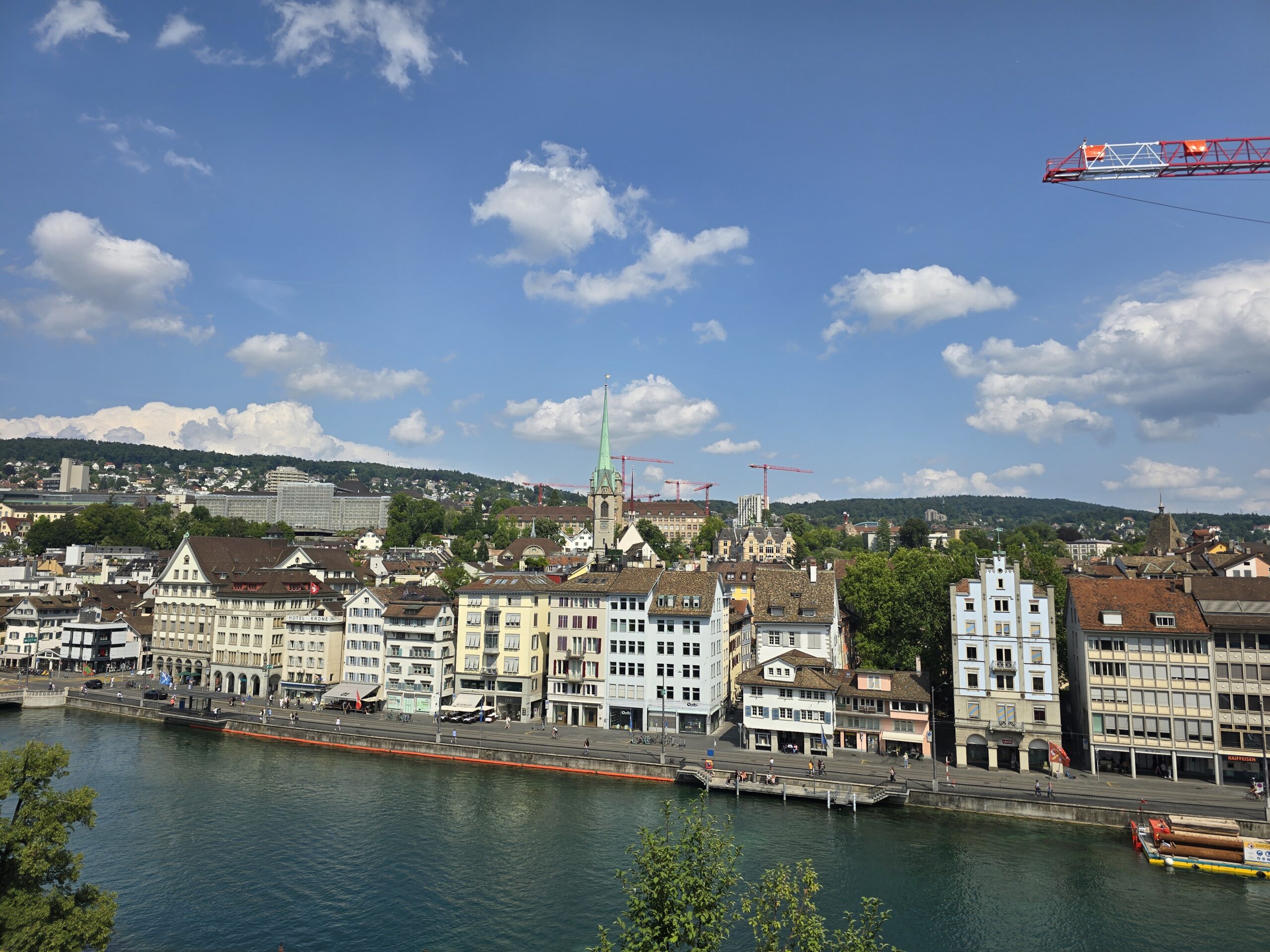 Riverfront buildings along the Limmat in Zurich, Switzerland, on a summer afternoon